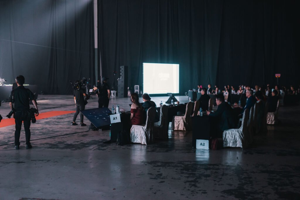 Event attendees watching a presentation. corporate video production in process