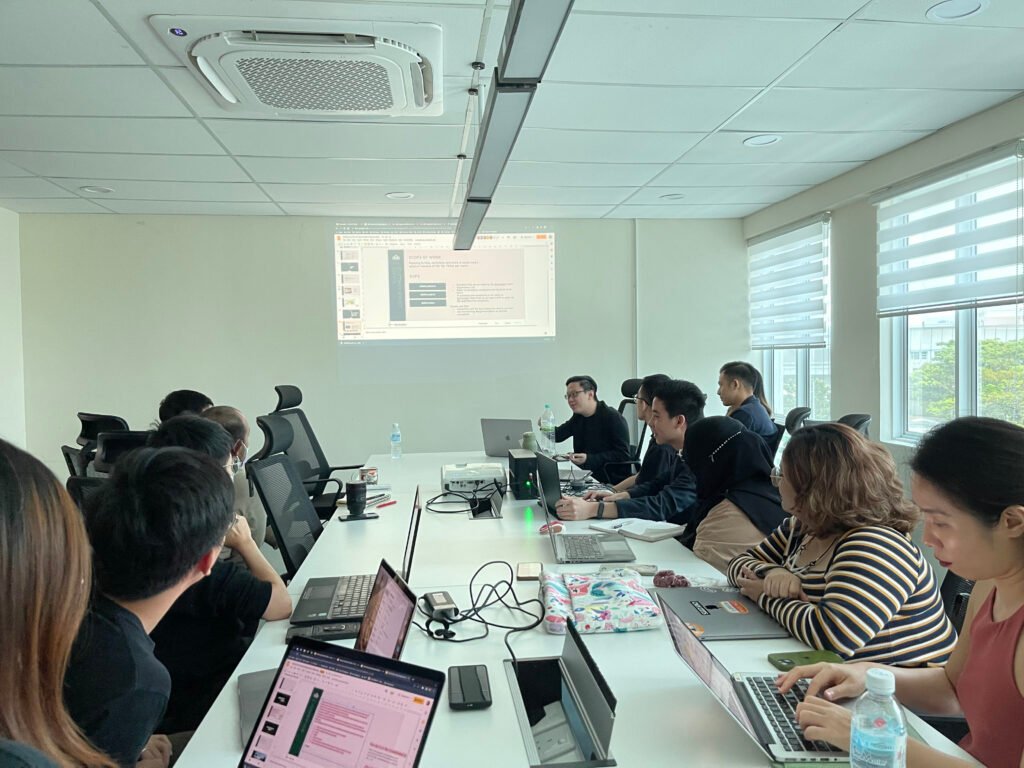 Group meeting with laptops and presentation. Corporate Video Strategy